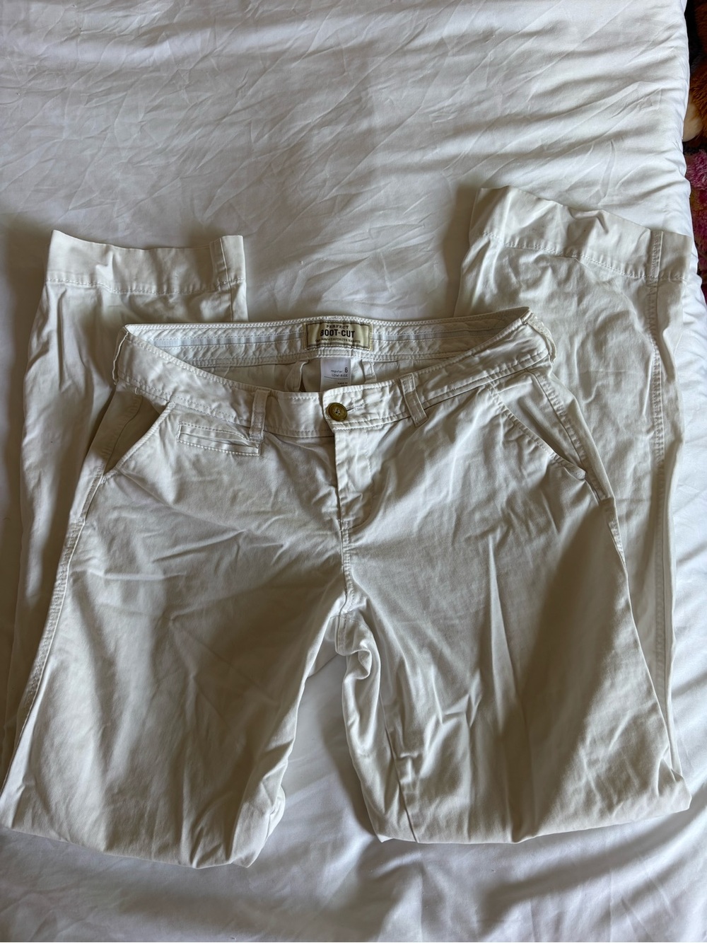 Cream low waisted boot cut pants